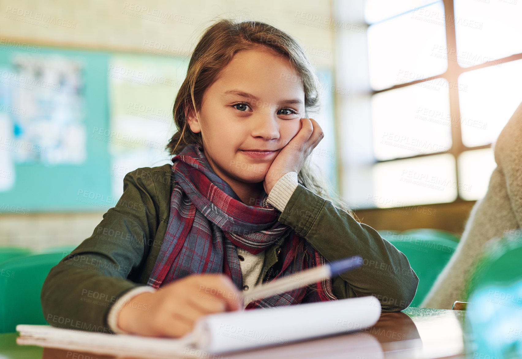 Buy stock photo Portrait of an adorable little girl doing her school work in class