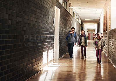 Buy stock photo Full length shot of a group of elementary school kids running in the corridor at school