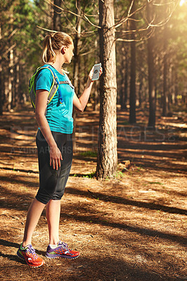 Buy stock photo Shot of a young woman out in nature to exercise