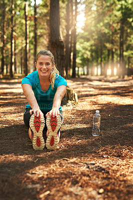 Buy stock photo Shot of a young woman out in nature to exercise