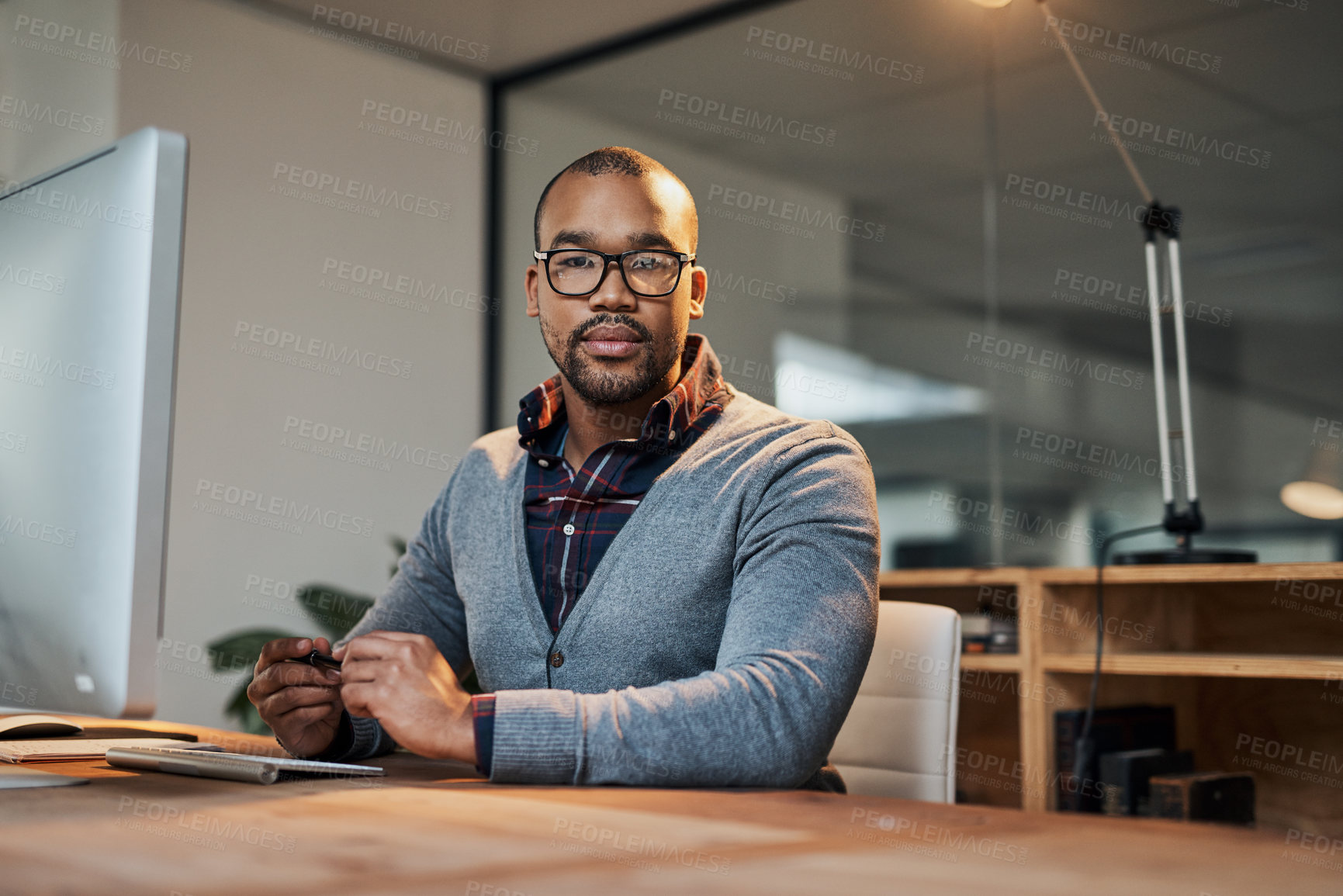 Buy stock photo Business man, laptop and portrait with night working in office on tech for web post planning and seo update. Creative, deadline and African employee at startup at desk for project of online writer 