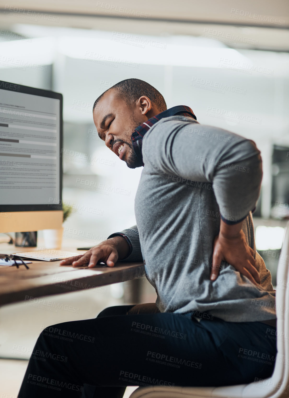 Buy stock photo Business man, computer and back pain with working in office on tech with injury and hurt muscle from desk job. Joint, inflammation and African employee at startup with medical problem and issue