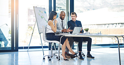 Buy stock photo Full length shot of a group of young businesspeople having a discussion while working in a modern office