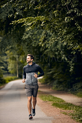Buy stock photo Shot of a sporty middle-aged man out running