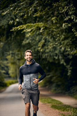 Buy stock photo Shot of a sporty middle-aged man out running