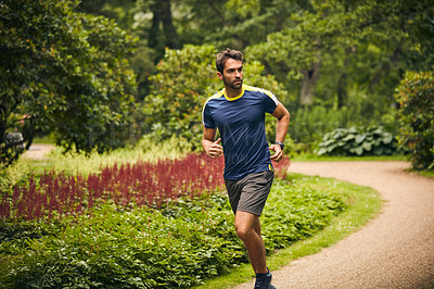 Buy stock photo Athlete, fitness and man in nature for running challenge, wellness and healthy outdoor exercise. Training, cardio and runner on path in park with commitment, progress and morning muscle workout.