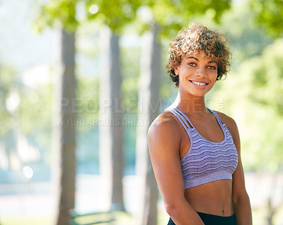 Buy stock photo Cropped shot of a sporty young woman standing outdoors