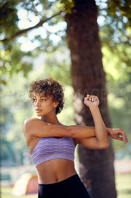Buy stock photo Cropped shot of a beautiful young woman exercising outdoors
