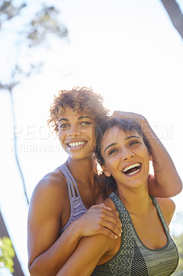 Buy stock photo Cropped shot of a sporty young couple spending the day outdoors