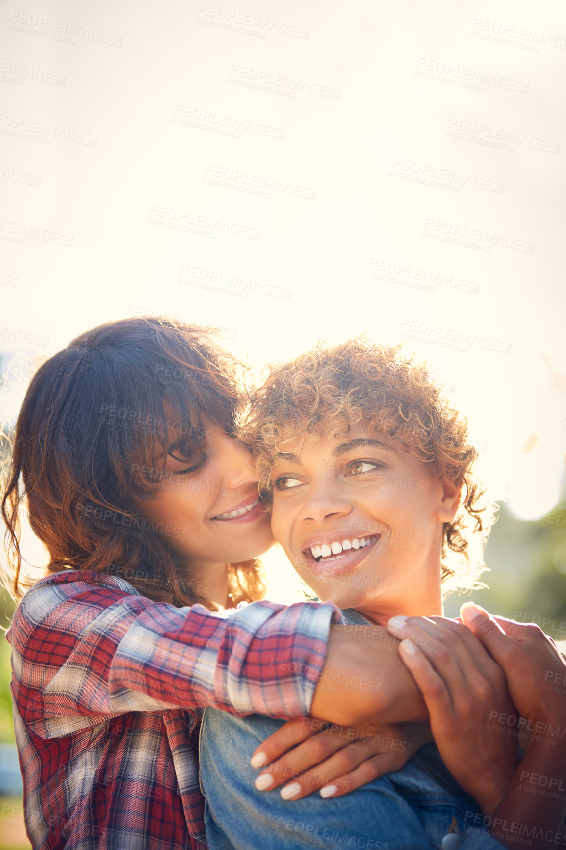 Buy stock photo Cropped shot of a young couple spending the day outdoors on a sunny day
