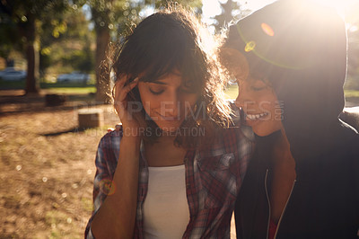 Buy stock photo Cropped shot of a young couple spending the day outdoors on a sunny day