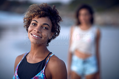 Buy stock photo Shot of a beautiful young woman spending the day at the beach