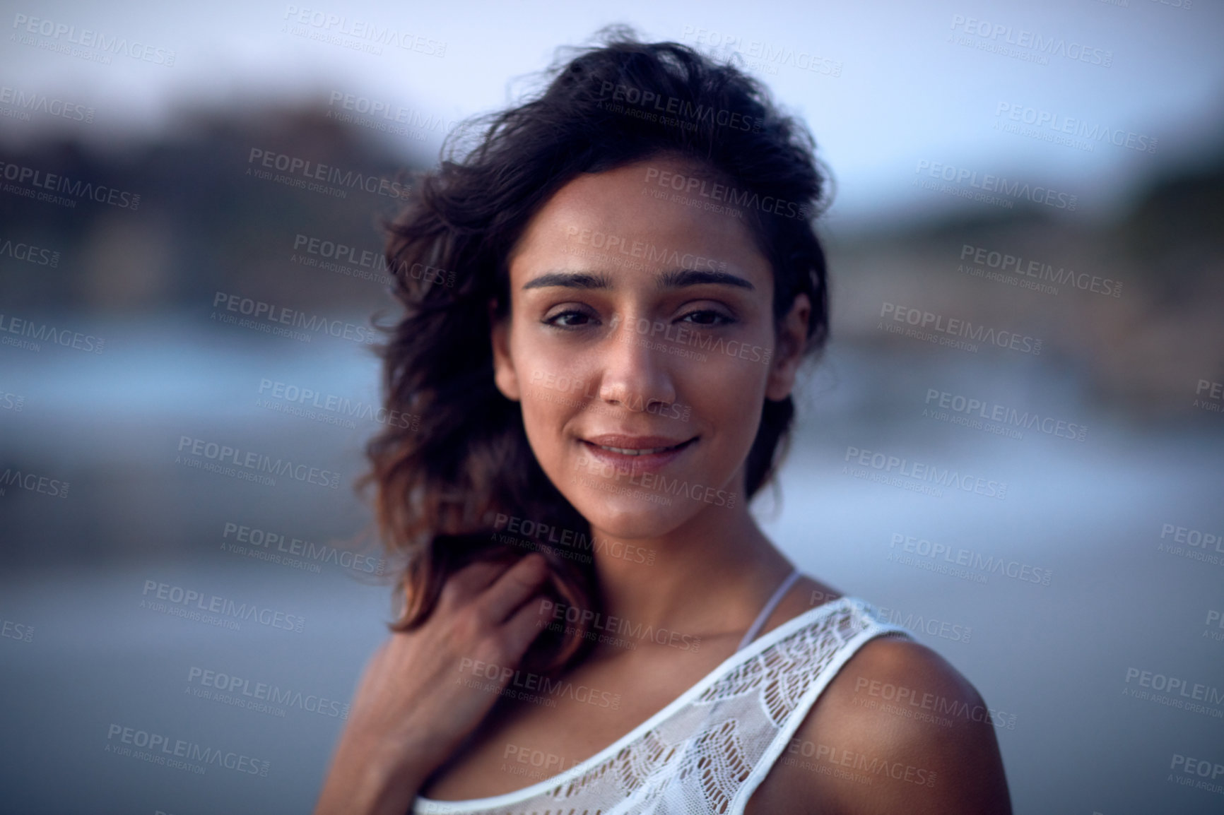 Buy stock photo Shot of a beautiful young woman spending the day at the beach