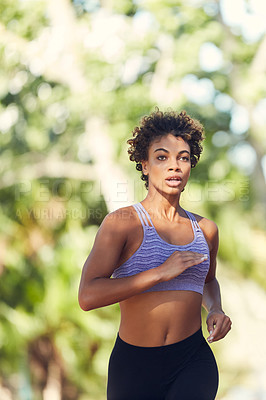 Buy stock photo Cropped shot of a beautiful young woman exercising outdoors