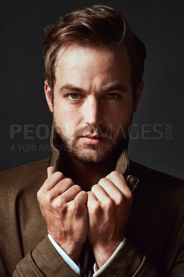 Buy stock photo Studio portrait of a handsome young man posing against a grey background