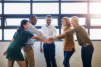 Buy stock photo Teamwork, fun and collaboration by diverse team joining hands in team building. Excited group linking, joining and supporting goal, mission or vision at work. Trust by professional creative coworkers