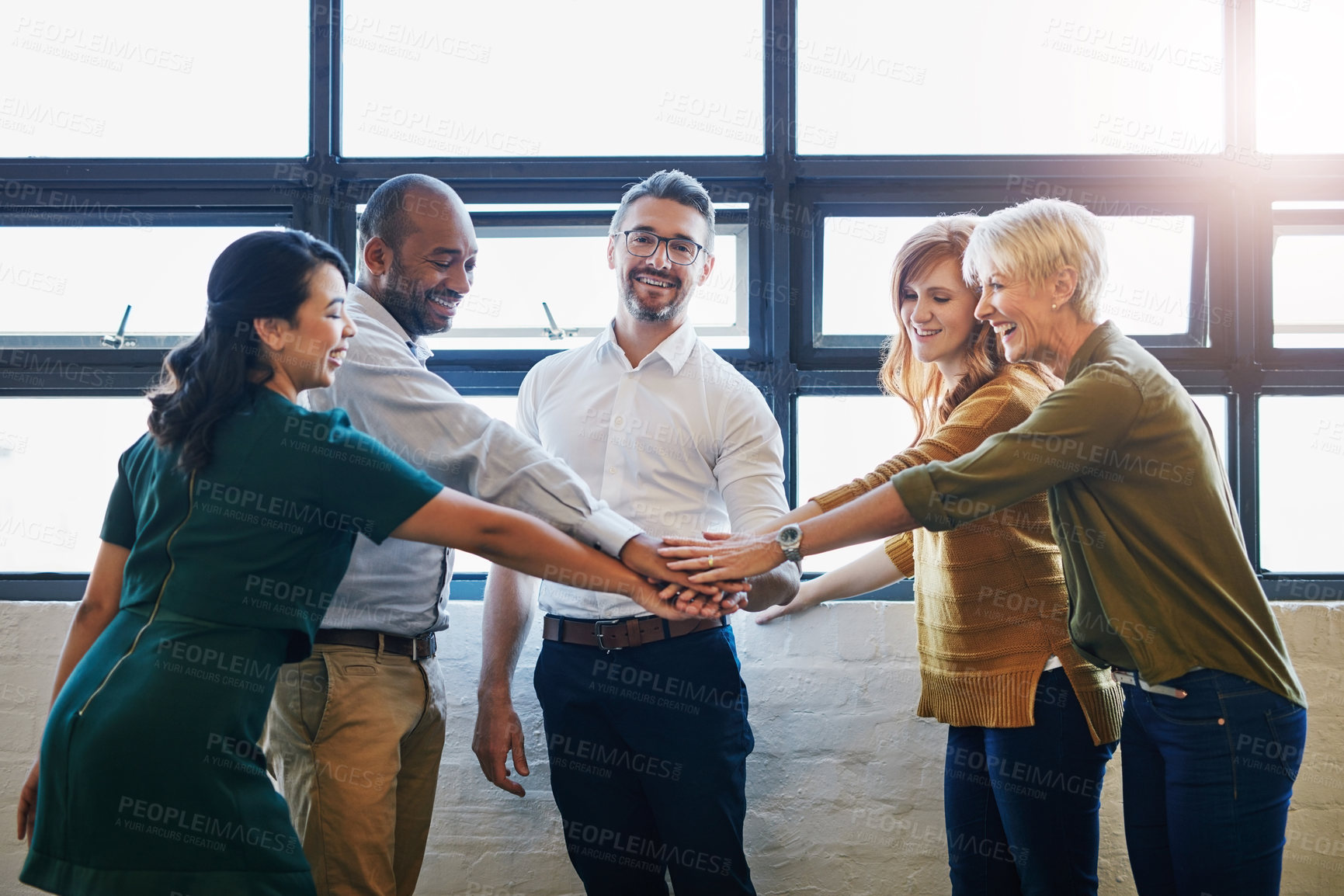 Buy stock photo Hands, huddle and businesspeople or team in office for synergy, diversity and collaboration with bonding. Motivation, solidarity and goal success in company with workforce, partnership and growth.