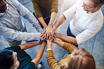 Buy stock photo Teamwork, hands in a huddle and working together with a team or group of business people and colleagues standing in the office. Togetherness, unity and motivation between creative coworkers at work