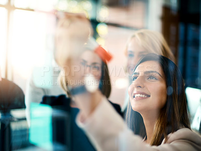 Buy stock photo Smiling business woman working on teamwork success and meeting collaboration and writing on colorful notes. Successful female office worker making notes on a board. Marketing team planning a strategy
