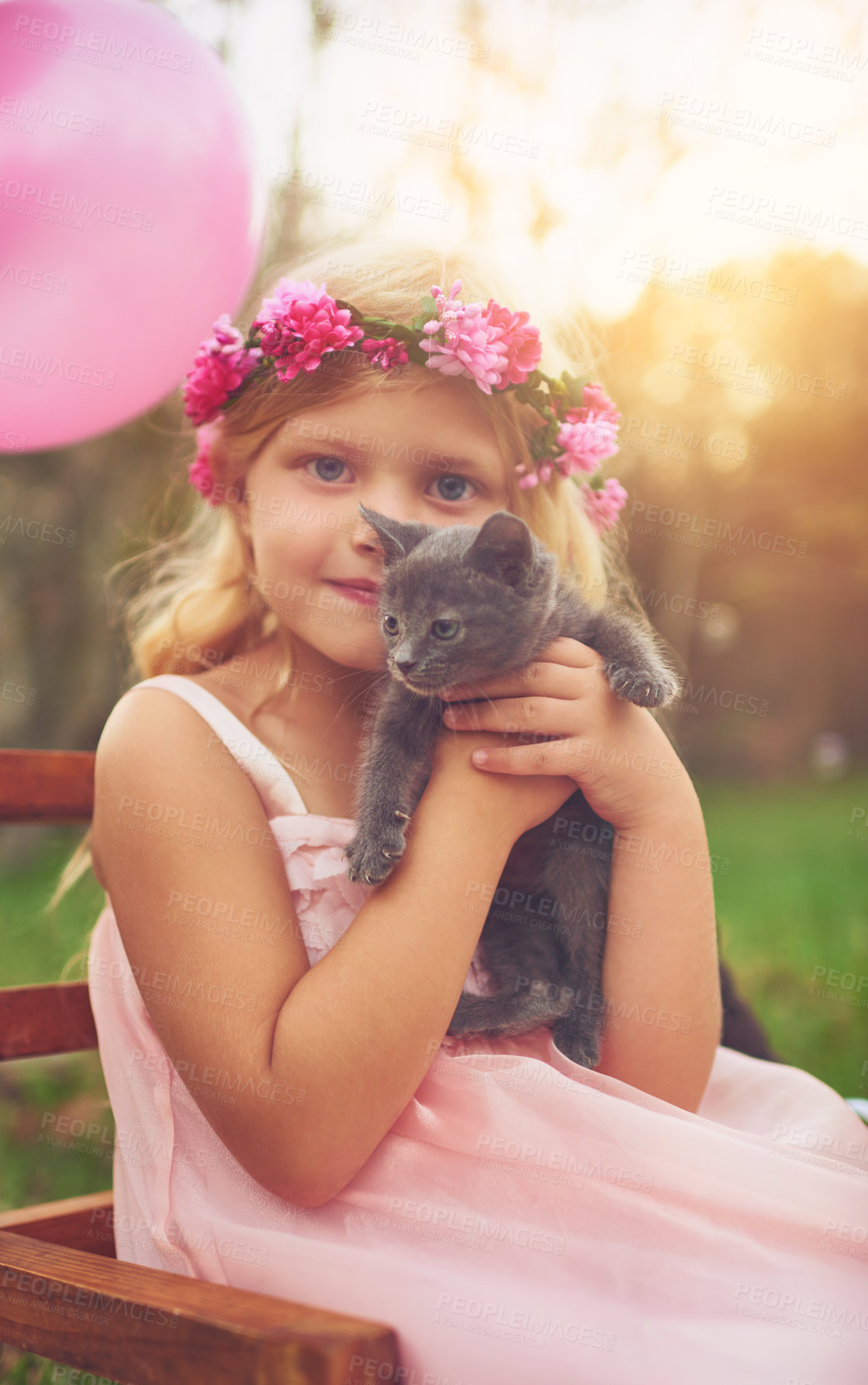 Buy stock photo Girl, portrait and hug with kitten for love or furry companion for comfort, friendship and growth or development. Kid, flower crown and cute animal in nature with affection, bonding and playing.