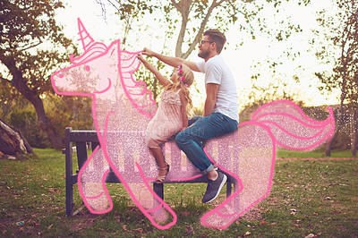 Buy stock photo Shot of a happy father and daughter riding a pink toy unicorn together in a park outdoors
