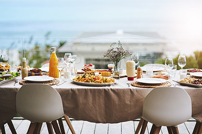 Buy stock photo Party, event and table with food, drinks and outdoor for fun, bonding and delicious meal. Chairs, outside and lunch with glasses, juice and social gathering for eating, restaurant and celebration