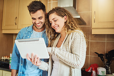 Buy stock photo Happy couple, online and tablet in kitchen for app, recipe and show tutorial on internet. Man, woman and digital technology in home for baking tips, information and reading cooking blog on website