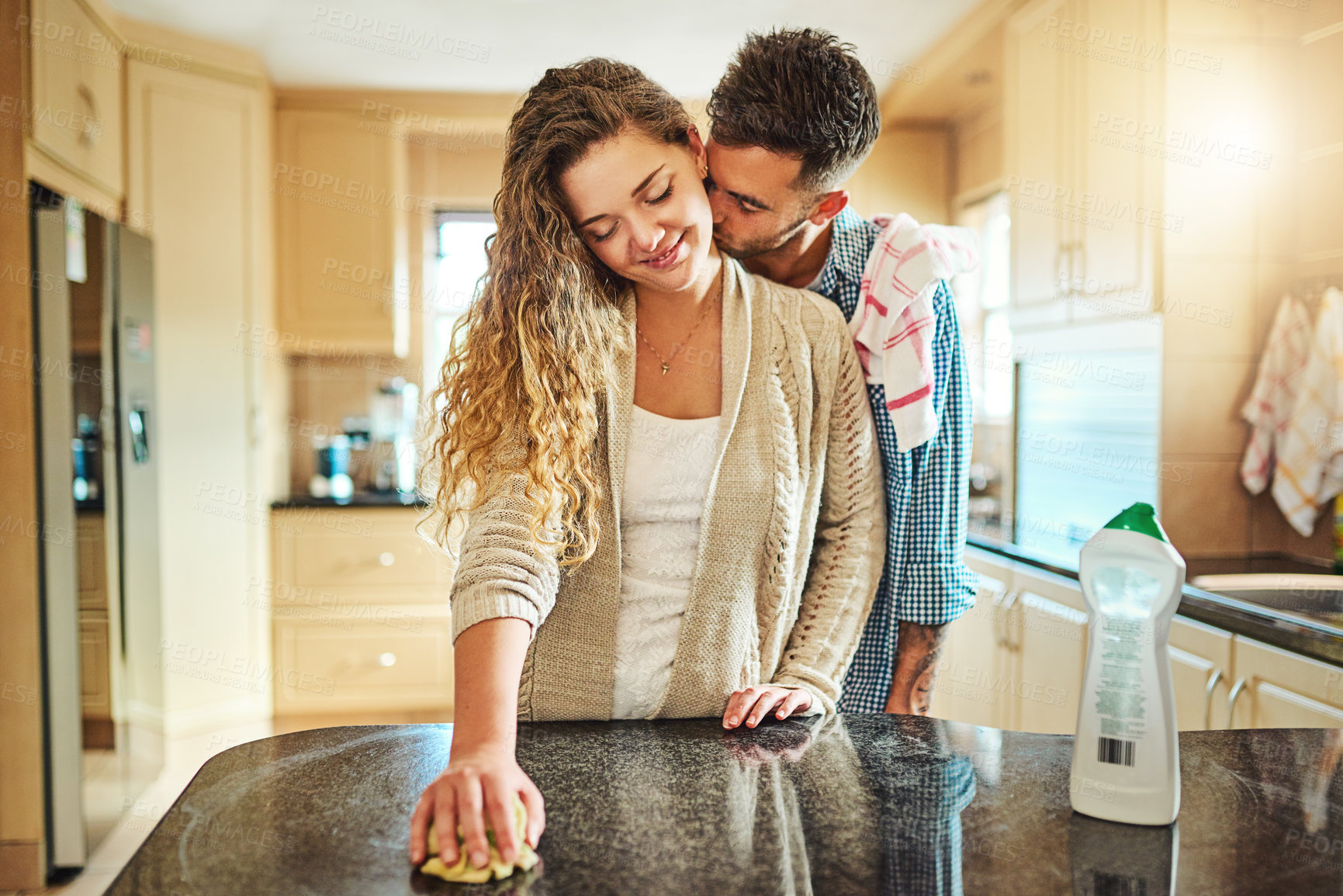 Buy stock photo Cropped shot of a young couple cleaning their house together