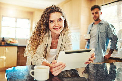 Buy stock photo Woman, home and happy with tablet at kitchen counter for social media, post and networking. People, couple and smile on portrait at apartment on internet in morning with subscription and app download