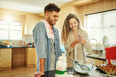 Buy stock photo Shot of a loving couple baking in their kitchen
