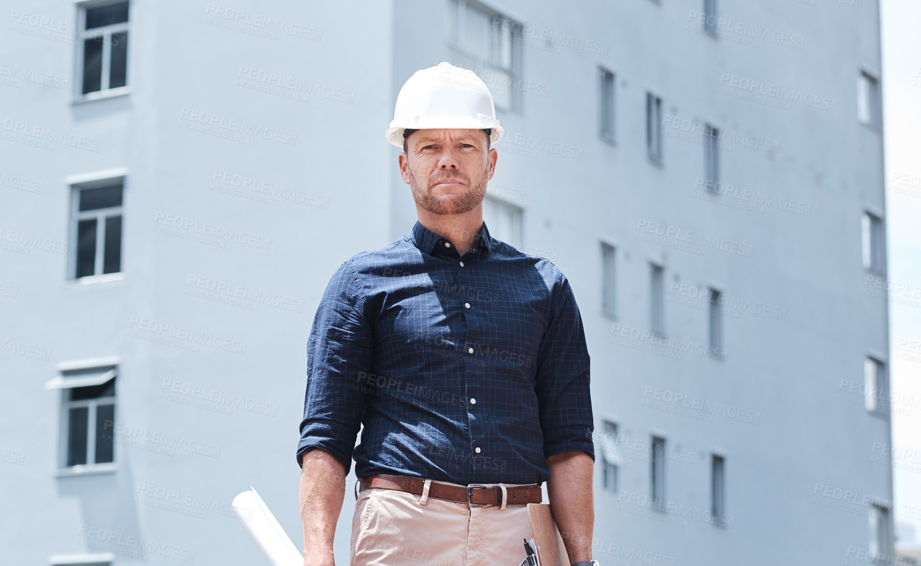 Buy stock photo Portrait, architecture and man at construction site with blueprint for inspection, project management and engineering. Maintenance, contractor or builder with hard hat and paperwork for safety