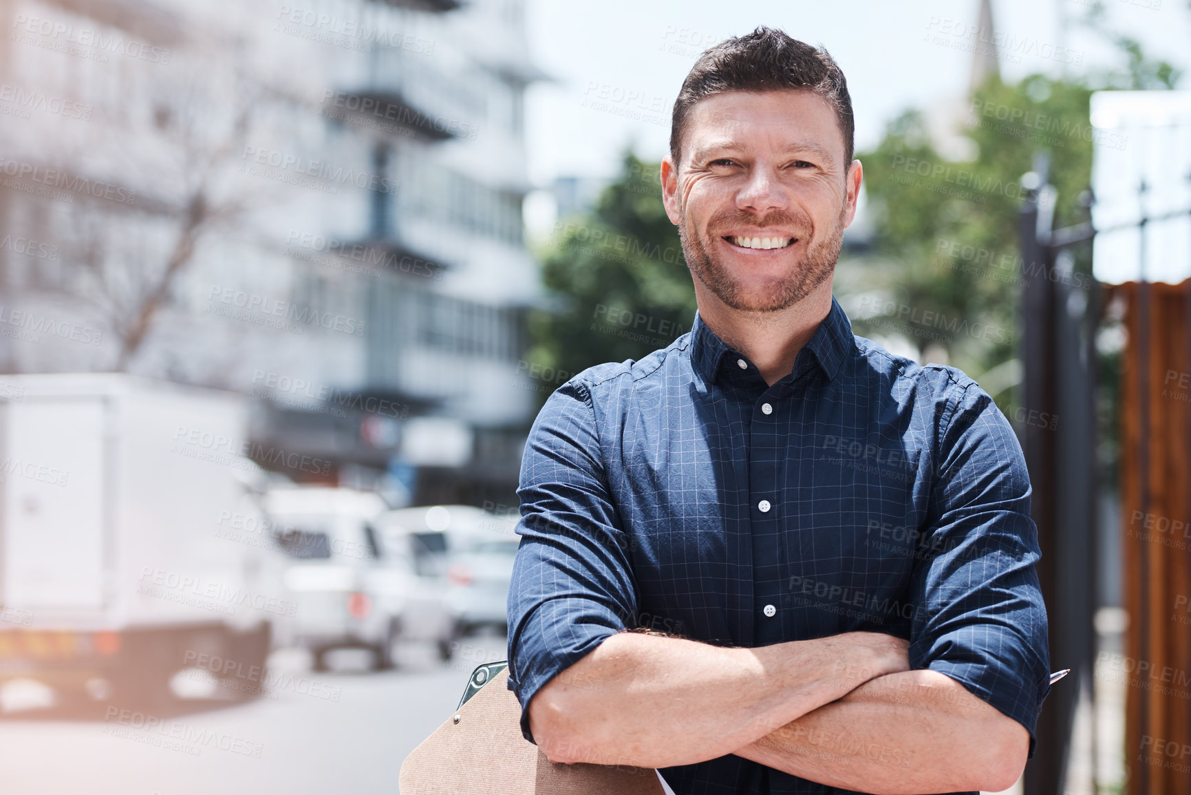 Buy stock photo Portrait, business and man with arms crossed in city, smile and clipboard with checklist, confidence and pride. Face, happy person and inspector with documents, construction site and career ambition