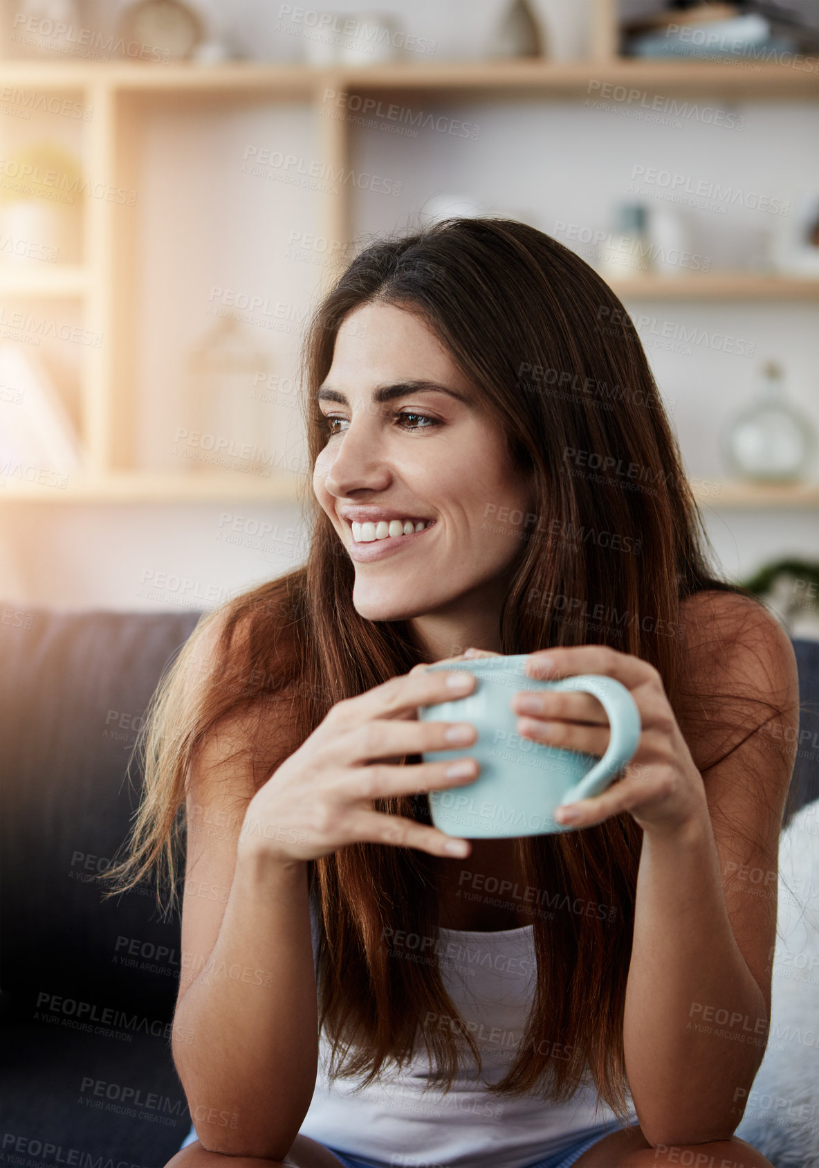 Buy stock photo Coffee, smile and thinking with woman on sofa in living room of home for break, rest or wellness. Comfortable, idea and relax with happy person drinking on couch in apartment for weekend time off