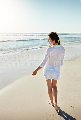 Buy stock photo Shot of a beautiful young woman enjoying her day at the beach
