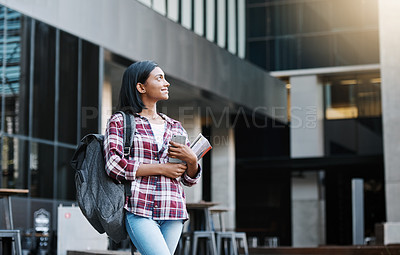 Buy stock photo Cropped shot of an attractive young female student standing outside on campus