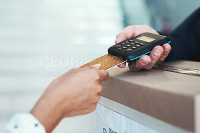 Buy stock photo Shot of an unrecognizable delivery man receiving payment from a female customer for her order
