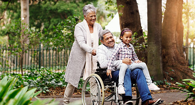 Buy stock photo Shot of an adorable little girl playing with her grandparents at the park