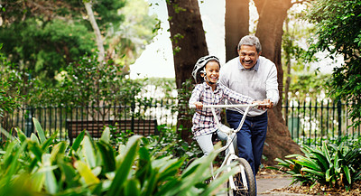 Buy stock photo Bicycle, girl and grandfather in a park, teaching and happiness with fun, bonding and loving together. Old man, granddaughter and grandad with a bike, outdoor and riding with guidance, help and joy