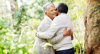 Buy stock photo Senior couple, happy and hug in park by trees with love, care or connection on vacation in summer. Elderly woman, old man and embrace in nature with smile for sunshine, relax or holiday in retirement