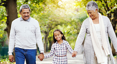 Buy stock photo Park, walk and grandparents holding hands with girl, smile and bonding on outdoor adventure together. Old man, woman and child in nature with love, support and happy family in garden with grandchild.