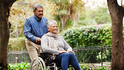 Buy stock photo Senior man, woman and wheelchair in park by trees with love, smile and walking on vacation in summer. Elderly people, old couple and person with disability in nature for rehabilitation in retirement