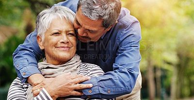 Buy stock photo Shot of an affectionate senior couple spending some time together at the park