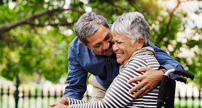 Buy stock photo Senior couple, hug and outdoor with wheelchair in park by trees for love, connection or laugh on vacation in summer. Elderly woman, old man and person with disability for rehabilitation in retirement