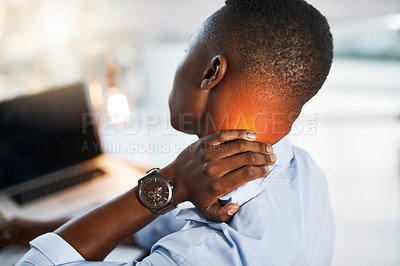Buy stock photo Shot of a young unrecognizable businessman suffering from neck pain while trying to work in the office