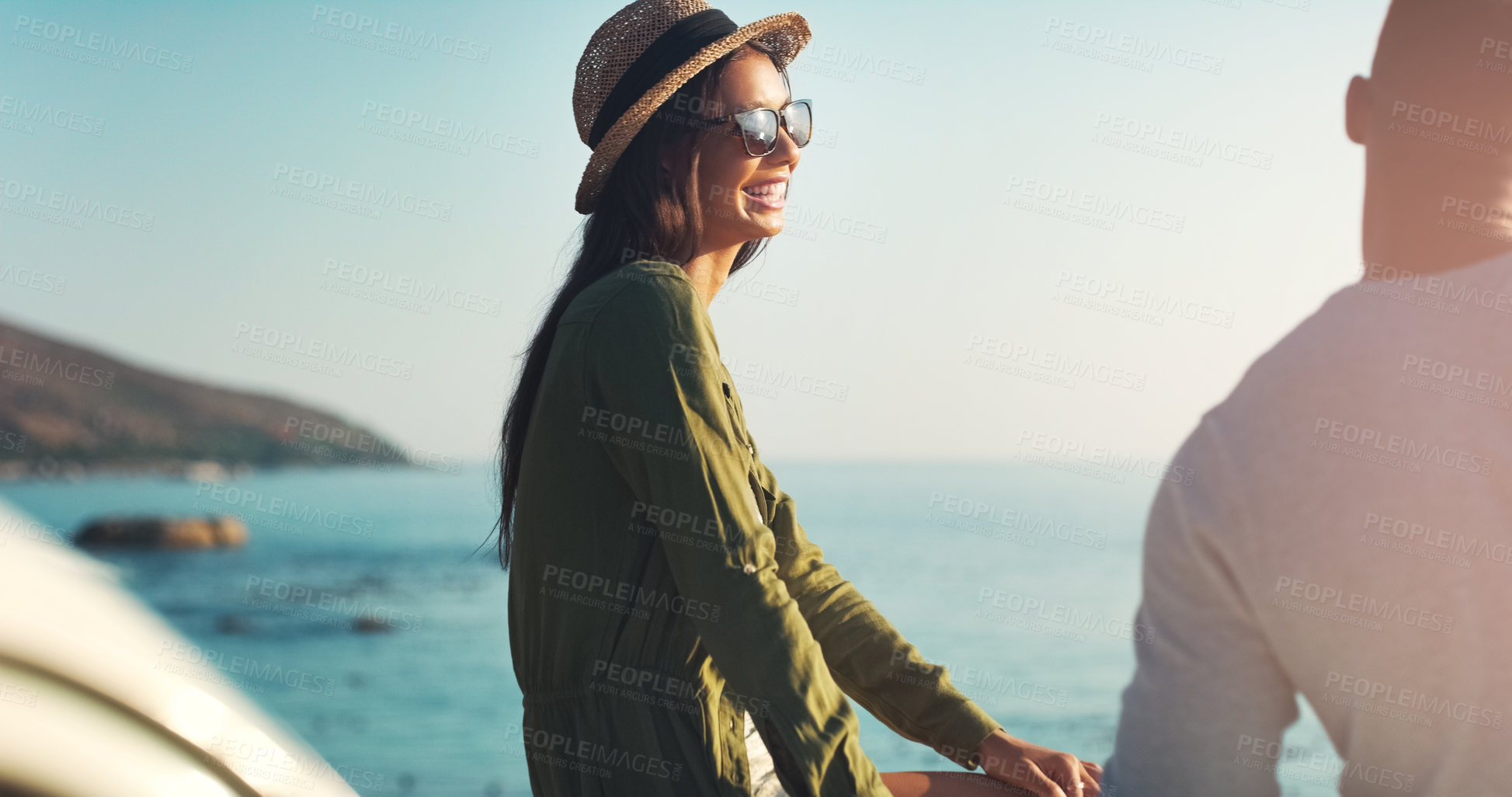 Buy stock photo Cropped shot of a young couple making a stop at the beach while out on a road trip