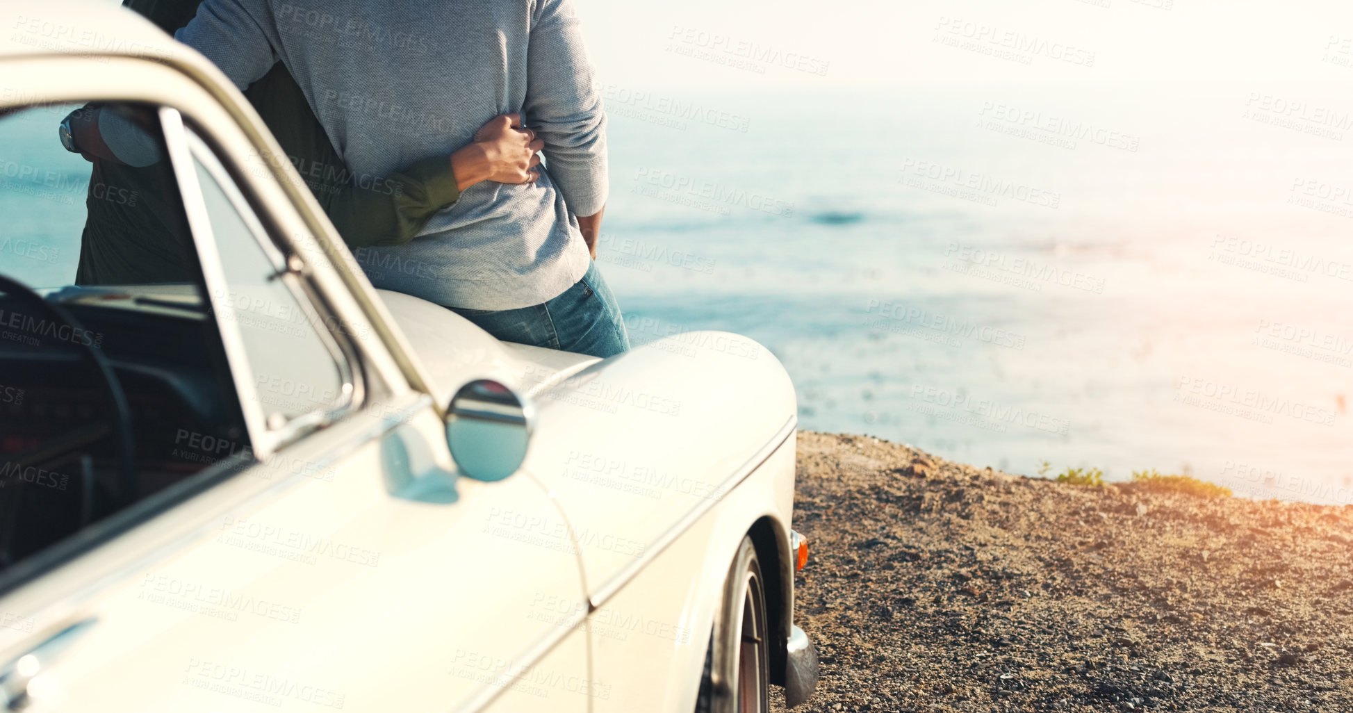 Buy stock photo Rearview shot of an unrecognizable young couple making a stop at the beach while out on a road trip