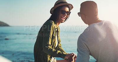 Buy stock photo Holding hands, relax and couple on cliff at beach for adventure together on tropical island. Love, man and woman on ocean vacation with water, romance and support on excited travel date in Greece.