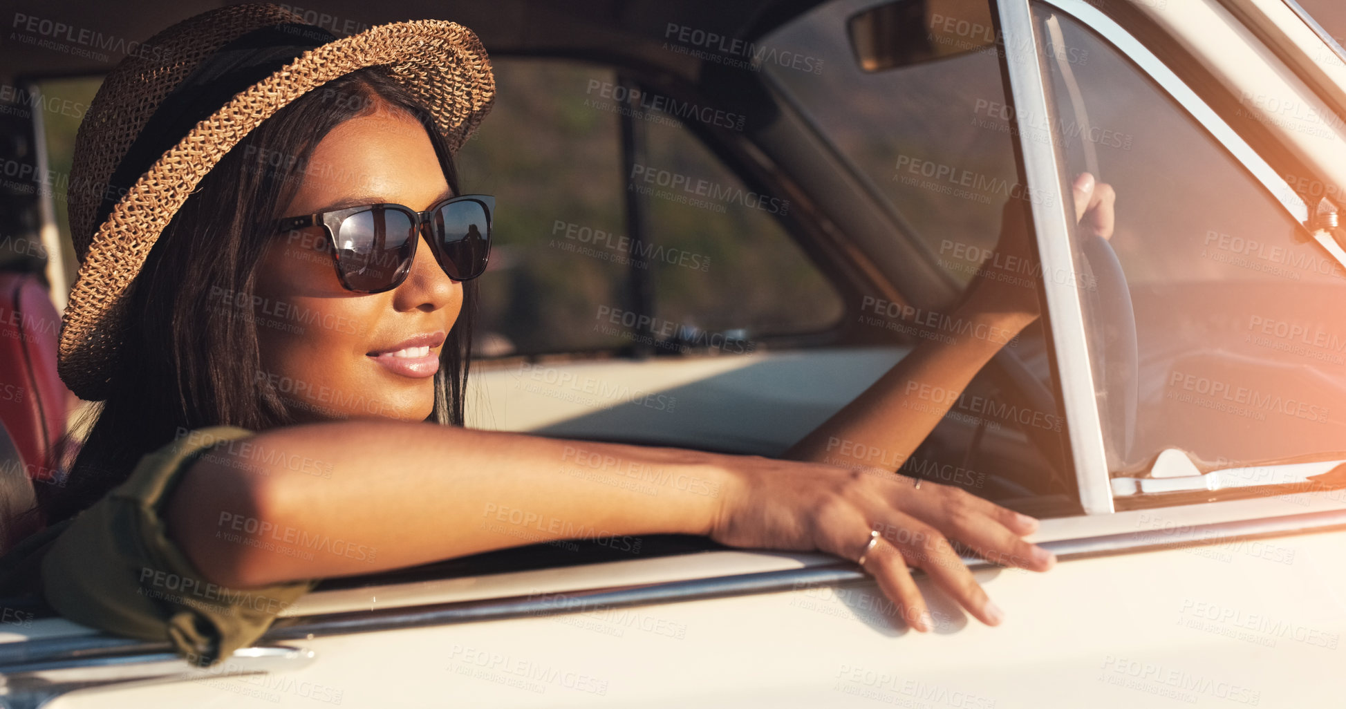 Buy stock photo Road trip, car window and flare with a woman enjoying travel or freedom on a joy ride as a tourist. View, sunset and relax with a young female traveler taking a drive alone outdoor for adventure