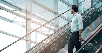 Buy stock photo Airport, travel and a business man on escalator with his luggage for a trip abroad or overseas. Corporate, global and suitcase with a male employee in a terminal for an international work flight
