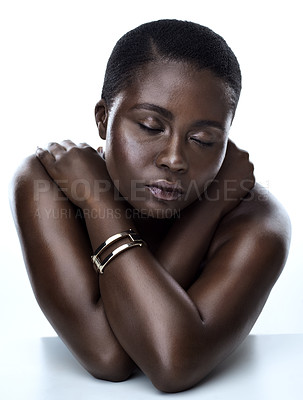 Buy stock photo Studio shot of a beautiful young woman striking a pose with her eyes closed  against a white background